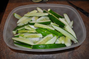 Chop up your cucumbers whatever way you desire.  This time I sliced them, next time I'm gonna do some hamburger style slices.